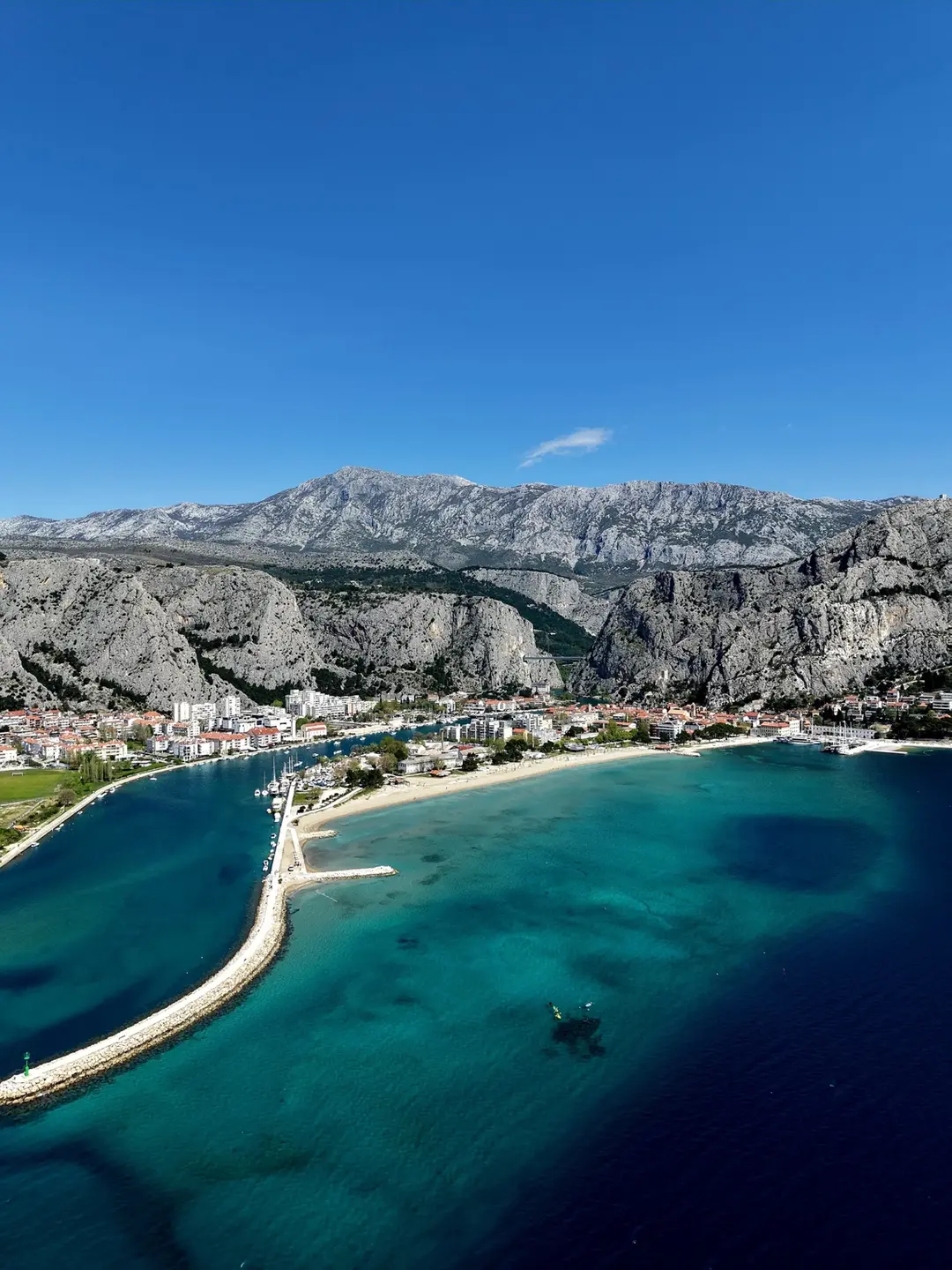 The Cetina river mouth, sandy beach and mountains above Omiš